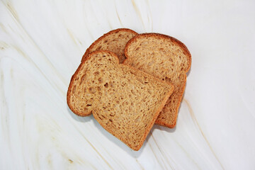square slices of toasted dark rye bread