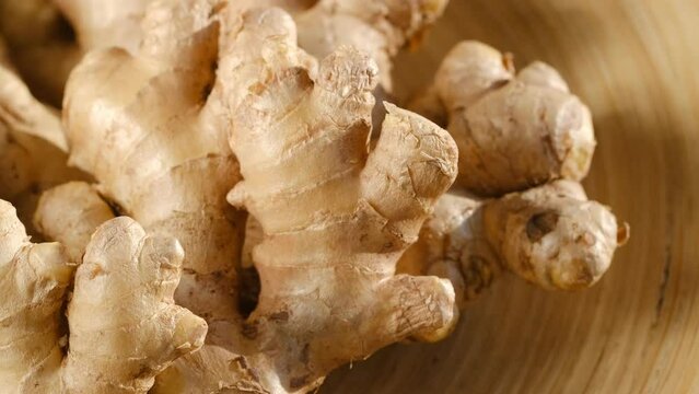 Whole ginger root on close up rotating 4K