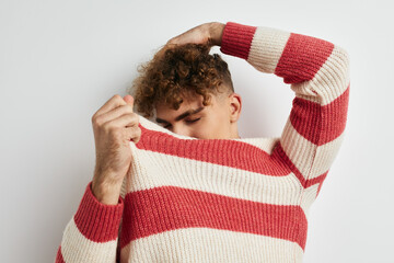 kinky guy hand gesture posing fun light background