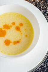 Seasoned fish soup on a white porcelain plate