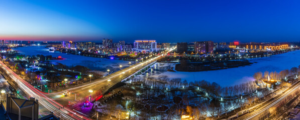 Fototapeta premium The city by the river is at night
