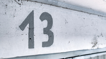Number thirteen above car garage door