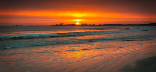 Fototapeta na wymiar Beautiful sunrise on the Baltic Sea beach in Sopot. Poland