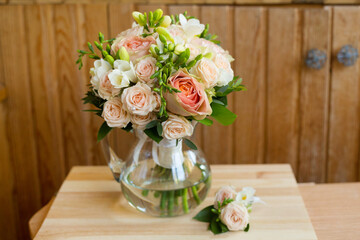 wedding bridal bouquet of roses and freesia 