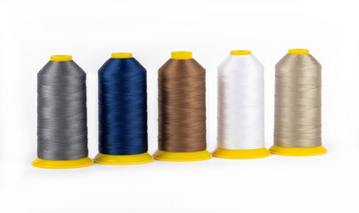 Spool of sewing thread, isolated on white background. Colored yarns used by factories in the clothing industry. Threads wound on the spool. Colored reels