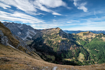 Beautiful alpine landscape with rocky mountains, hills and forest at a sunny day in the Allgau Alps near Oberstdorf. Bavaria, Germany, Europe