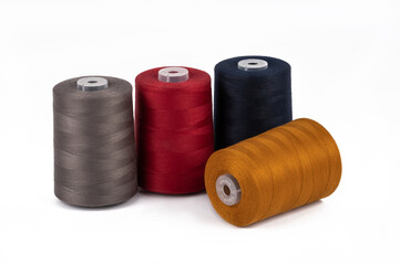 Spool of sewing thread, isolated on white background. Colored yarns used by factories in the clothing industry. Threads wound on the spool. Colored reels