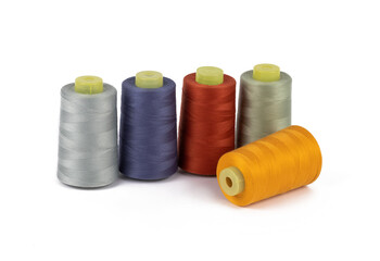 Spool of sewing thread, isolated on white background. Colored yarns used by factories in the clothing industry. Threads wound on the spool. Colored reels