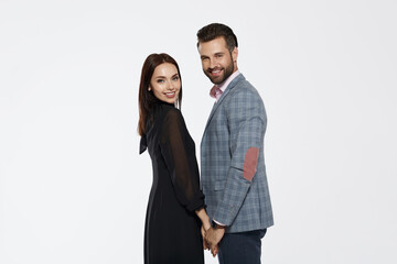 Young couple stand and hold hands of each other