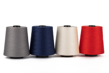 Spool of sewing thread, isolated on white background. Colored yarns used by factories in the clothing industry. Threads wound on the spool. Colored reels