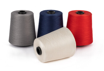 Spool of sewing thread, isolated on white background. Colored yarns used by factories in the clothing industry. Threads wound on the spool. Colored reels