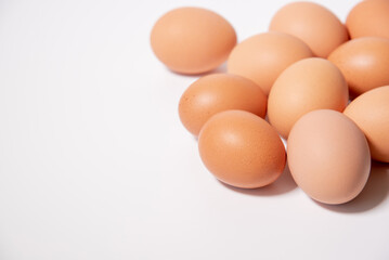 ten chicken eggs on the right on a white background