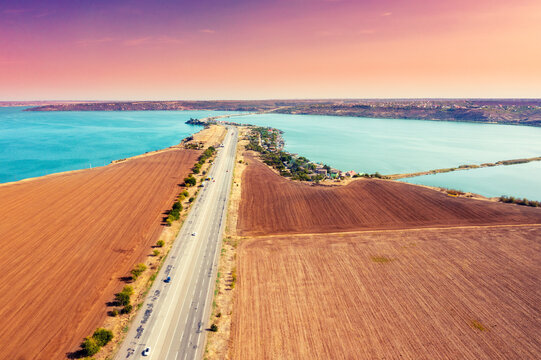 View from above of highway and rod bridge over Khadzhibey Estuary. Ukraine