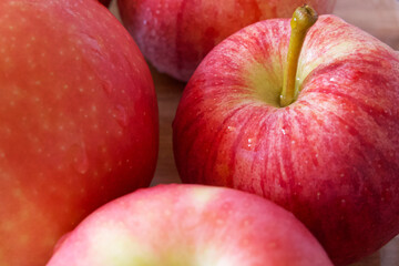 Macro photo of ripe red apples of gala and Ligol varieties. Apple close-up.
