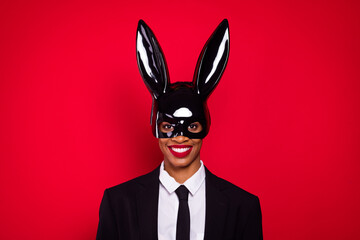 Photo of young cheerful girl guy masquerade wear bunny mask provocative isolated over red color...