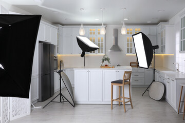 Naklejka premium Professional photo studio equipment prepared for shooting kitchen interior