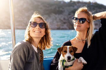 Portrait two young adult beautiful pretty caucasian woman enjoy sailing family cute adorable little...