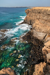 Beautiful cliffs and turquoise waters in the northwest coast of Fuerteventura, near El Cotillo, La Oliva, Canary Islands, Spain