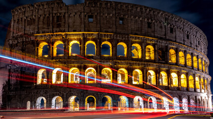 Cars light trails near the Coloseum,    Rome, Italy. Also Known As Flavian Amphitheatre In Evening...