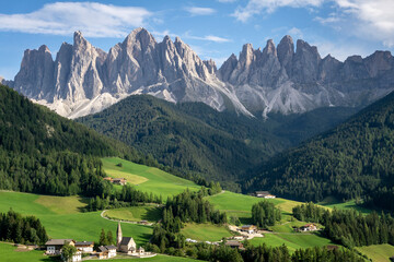Fototapeta na wymiar The great rocky walls of the Odle Dolomites Group above the village of Santa Maddalena in Val di Funes.