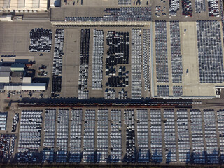 Aerial view of thousands of cars parked in port ready to be distributed