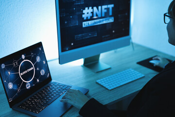 Young woman buying NFT on Blockchain market - New Technology Token Concept - Soft focus on computer screen