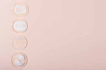 Top view of the cosmetic cream on the acrylic podiums,different swatches.Pastel colors,copy...