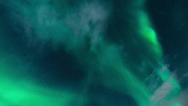 A northern lights also known as aurora borealis time lapse straight over head. High quality 4k footage