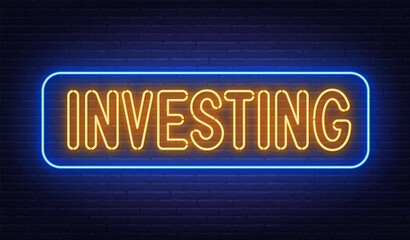 Obraz na płótnie Canvas Investing neon sign on brick wall background