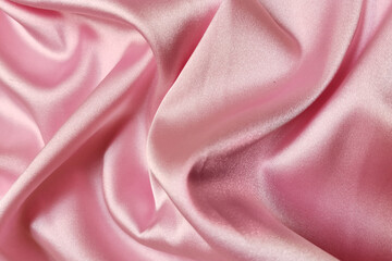 Pink crumpled or wavy fabric texture background. Abstract linen cloth soft waves. Silk atlas or...