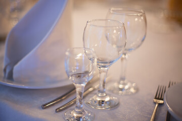 three glasses are on the wedding table