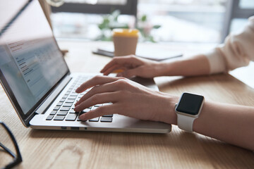 Cropped of businesswoman working at desk at office