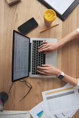 Cropped of businesswoman working at desk at office