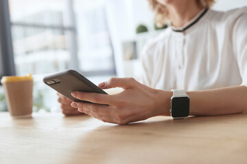 Cropped of businesswoman working at desk at office