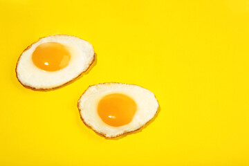Two flawless frie egg on the yellow background.