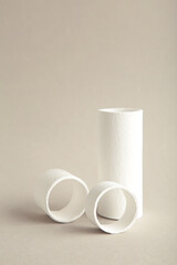 Abstract minimal scene with geometrical forms on grey background. Abstract background. Space for text. Vertical photo