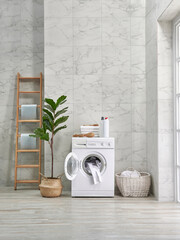 Washing machine decorative style in the bath room, vase of plant, mirror and wooden stairs, towel and brush, dirty clothes in wicker basket.