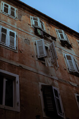 Facade of building. Montenegro style. Evening in the city.