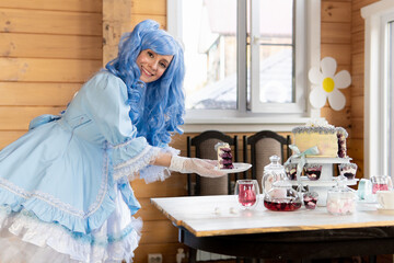 Beautiful woman with blue wig in a dress in the house.