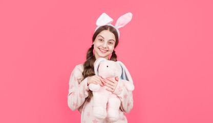 happy easter teen girl in bunny rabbit ears and pajamas play with toy, easter