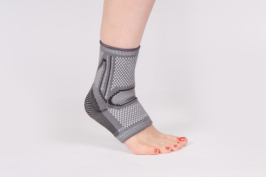 Orthopedic Ankle Brace. Medical Ankle Bandage. Medical Ankle Support Strap Adjustable Wrap Bandage Brace foot Pain Relief Sport. Leg Brace isolated on white background. Trauma Ankle orthosis. Injury.