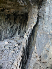 Rocky cave in grey color with featheredges