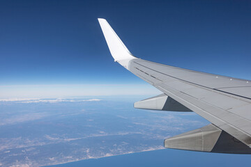 view from the plane window. wing and city. air travel