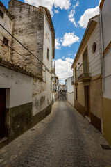 Fototapeta na wymiar Paved road. Alhama de Granada, Andalusia, Spain. Beautiful and interesting travel destination in the warm Southern region. Public street view.
