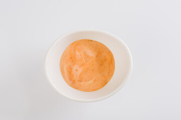 sauce on a white plate on a white background