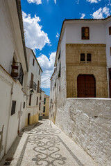 Fototapeta na wymiar Empty path. Alhama de Granada, Andalusia, Spain. Beautiful and interesting travel destination in the warm Southern region. Public street view.