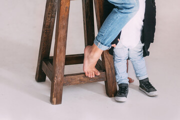 mom and baby's feet in the studio