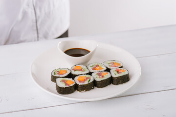 chef preparing sushi. white background