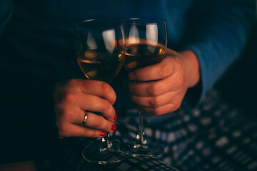 champagne glasses in the hands of lovers