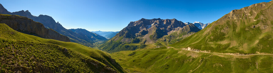 View of the Ecrins National Park from Col du Galibier mountain pass in early morning. Panoramic view from Briancon Region to Ecrins Massif in the Hautes-Alpes (French Alps). France